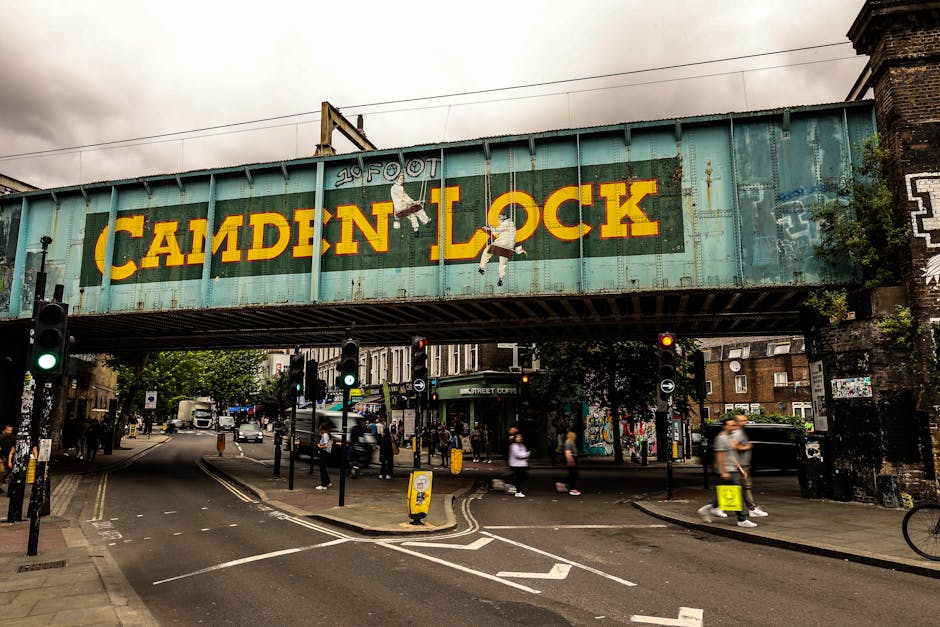 A wide view of the historic London Bridge Station building, featuring ornate stonework and classic architectural details, with the Southern Railway sign visible at the top. The foreground shows a spac